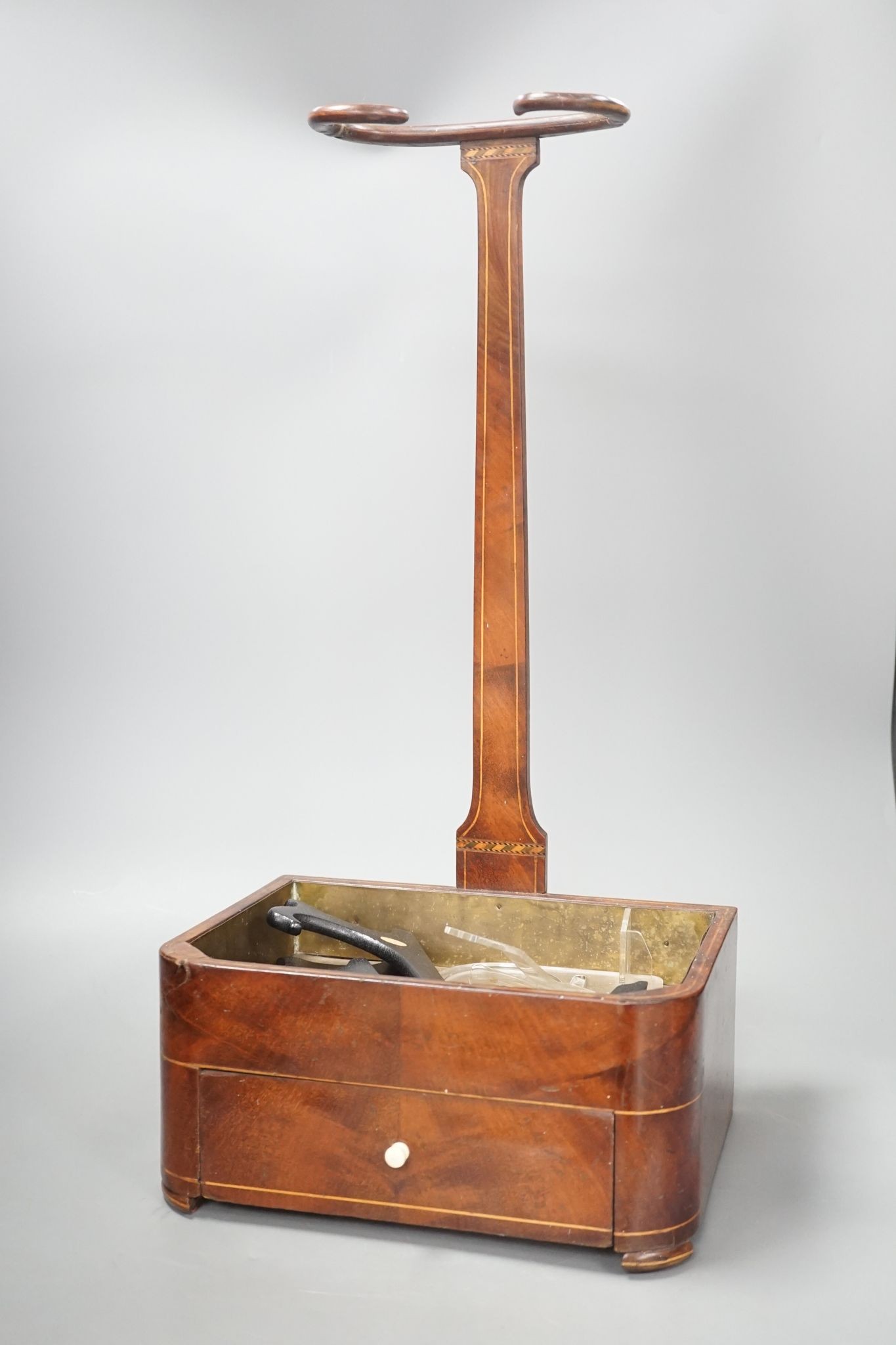 A 19th century satinwood strung mahogany stick stand with fitted drawer, 54 cms high.